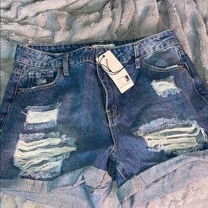 Keep em guessing distressed denim shorts